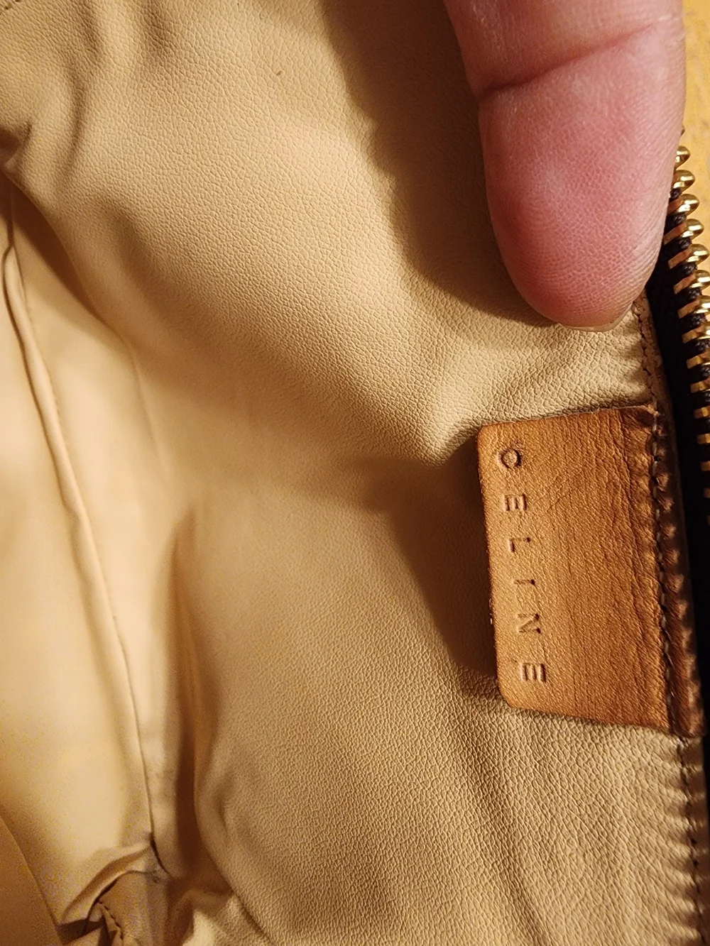 CELINE pouch is crafted from brown Triomphe canvas and features tan leather trim